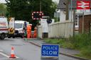 Driver smashed through railway level crossing during high speed chase