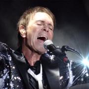 Sir Cliff Richard, "the Peter Pan of pop", wowed the crowds at Cartmel Racecourse.
