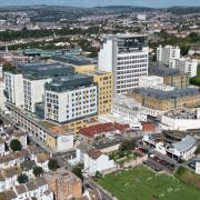 A woman smuggled drugs into the Royal Sussex County Hospital in Brighton for her prisoner boyfriend to pick up