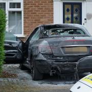 Car fire being investigated after police arrest man on suspicion of arson