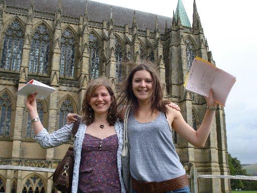 Students from Lancing College show off their grades.