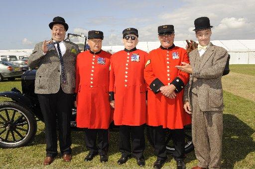 Chelsea pensioners l-r Don Crassweller, 71, Les Perrier, 78, and Dave Jackson, 71, with Laurel and Hardy impersonators. 