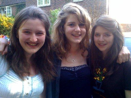 Ardingly College pupils Emilia Carslaw (centre) and twins Florence (left) and Olivia Bell celebrate their 32 A* GCSE grades