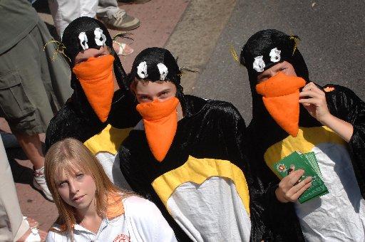 Penguins collect money as the parade passes through Worthing.