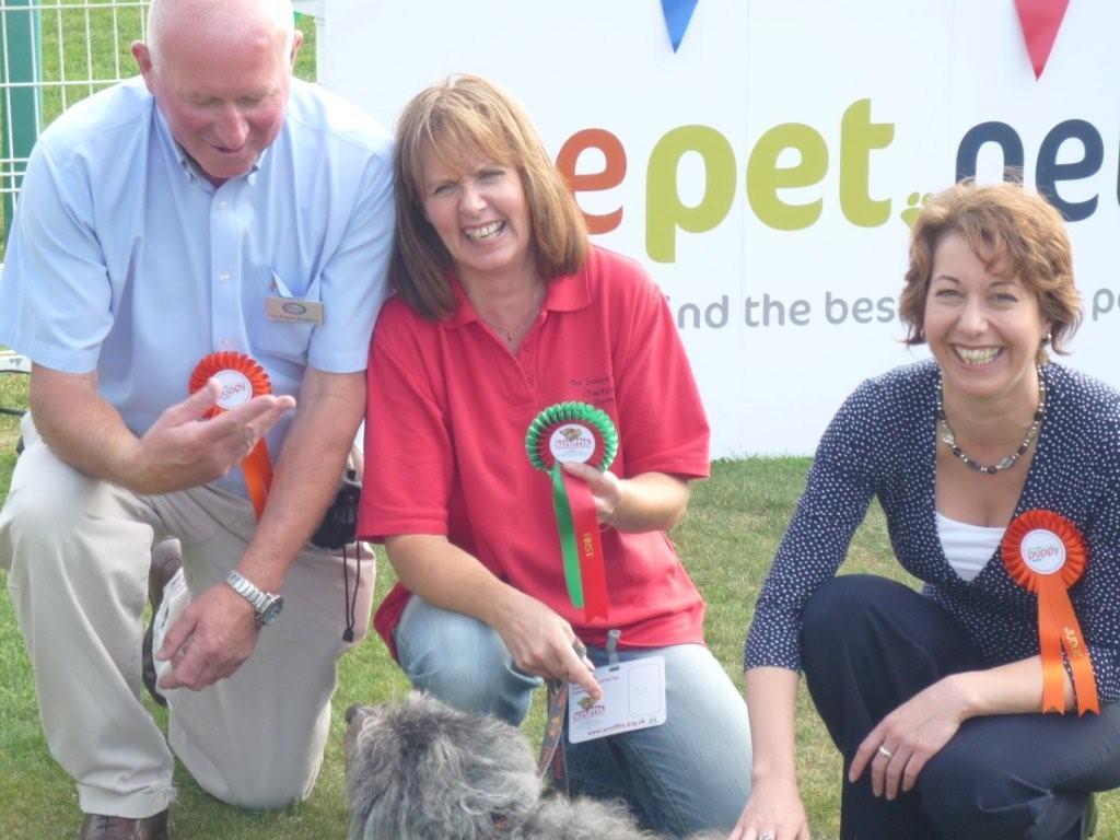 Nancy Platts helped judge the Golden Oldies character. She is pictured here with Rags, who won first prize and owner Roger Mugford. Nancy said: "She won, but was very mischievous and wouldn't sit still."
