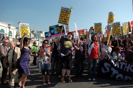 Anti Government protestors make their point heard outside the Labour Party Conference in Brighton.