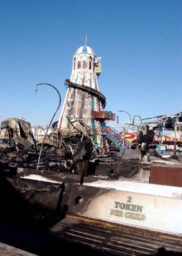 Fire damage to the Palace Pier beside the helter skelter this morning after last night's blaze. February 2003.