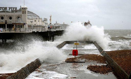 Large waves crash over the groyne beside the Palace Pier in Brighton today as storms battered the Sussex coast. March 2008.