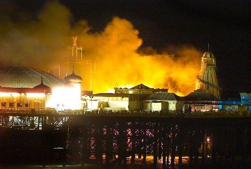 The Palace Pier up in flames as the ghost train catches fire. Picture by Aaron St Clair.