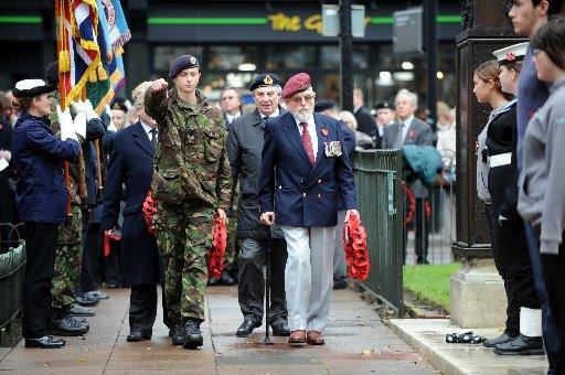 Wreath leayers step forward at the Act of Remembrance service in Brighton today