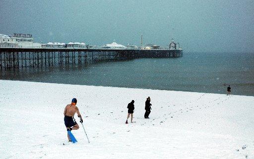 Brighton Swimming Club members take their daily dip despite the snow