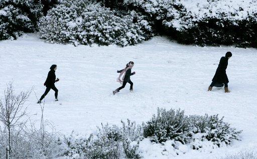 Children pictured playing in the snow in Brunswick Square, Hove