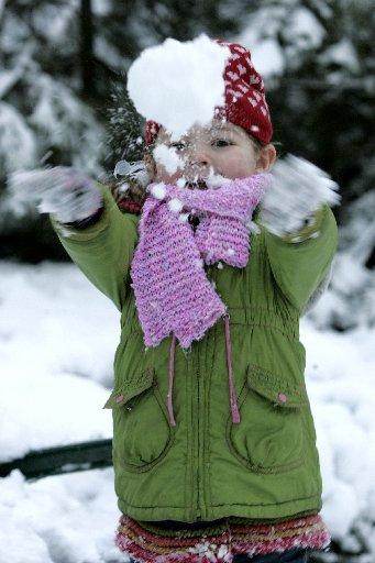Nia Sayer, 4, pictured having fun in the snow in Brunswick Square, Hove