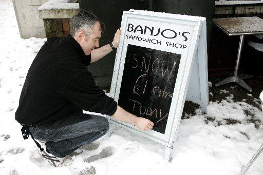Paul Ritchie is writing a snow based board for his sandwich shop on Western Road
