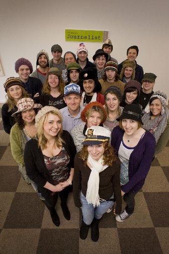 Students fro Brighton Journalist Works pose wearing hats for their Hats for Haiti campaign.