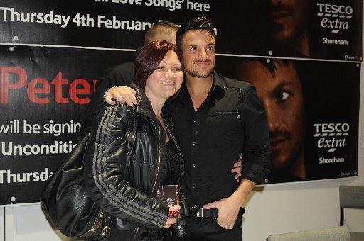 Pop star Peter Andre was confronted by more than 1,000 fans screaming ‘We love you’ as he signed copies of his new album.

Crowds queued for hours to meet the singer at the Holmbush Shopping Centre in Shoreham today.

It was one of his first publi