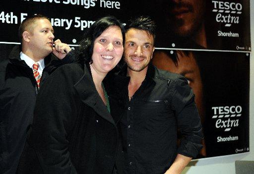 Pop star Peter Andre was confronted by more than 1,000 fans screaming ‘We love you’ as he signed copies of his new album.

Crowds queued for hours to meet the singer at the Holmbush Shopping Centre in Shoreham today.

It was one of his first publi