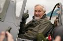 102-year-old Jack Hemmings AFC gives a thumbs up as he lands after flying a Spitfire plane