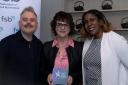 Iris Jackson, OG Kicks head of operations, centre with the award and Simona Daniel and Gary Salters of the Federation of Small Businesses