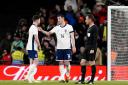 Lewis Dunk talks things over with Declan Rice during England's defeat to Brazil
