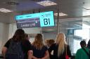 Passengers wait at a departure gate at Ferenc Liszt International Airport in Budapest, Hungary, as flights to the UK and Ireland have been cancelled as a result of air traffic control issues in the UK (PA)