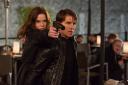 Rebecca Ferguson backed up by Tom Cruise in Mission: Impossible: Rogue Nation...