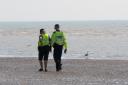 Police officers at Camber Sands near Rye