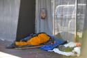 Homeless person sleeping in West Street, Brighton..