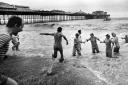 Swimmers enjoy their dip on Christmas Day by the Palace Pier in Brighton in 1983