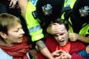 Caroline Lucas grapples with police at Balcombe yesterday