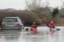 Lifeguards Mike Barreto and Paul Bass  in their canoes at Barcombe Cross, near Lewes