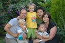 Ricardo Sabates with Asher, one, and Oliver, four, Enzo Stingone with Julie and their son Cameron Stingone, who are residents of Loder Road, Brighton, who have set up a community group called Bundles of Joy