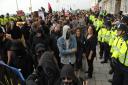 Police and protesters at Brighton in April