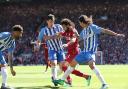 Connor Goldson, Lewis Dunk and Ezequiel Schelotto look to stop Mo Salah at the end of the 2017-18 season