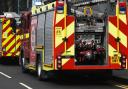 Fire service are responding to an overturned lorry catching fire in Balcombe
