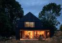 The 'striking' Black Timber House in Rodmell near Lewes has won two architecture awards