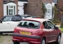 Cars were left smashed and homes damaged by the tornado last night