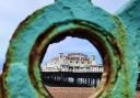 Brighton Palace Pier through the seafront railings