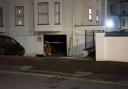 A car has hit a building in Eastbourne