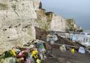 Floral tributes have been left at the bottom of Seaford Head