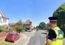 A stock image of a police officer superimposed onto Hawthorn Road, Bognor