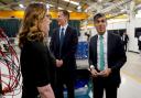 Prime Minister Rishi Sunak (right) and the Chancellor Jeremy Hunt (centre), during a visit to a business in Oxfordshire