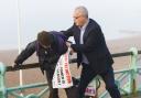 Blogger and protester scuffle on Brighton seafront as TV cameras roll