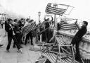 Mods pictured in May 1964 throwing deckchairs from the roof terrace of Brighton Aquarium on to Madeira Drive below
