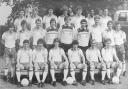 Steve Foster, third from left in back row, poses with the England squad