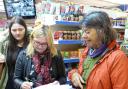 Dee Edmonds getting signatures in the Best One Express. Picture by Della Cheshire