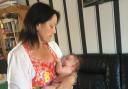 Marion Cook cuddles her baby grandson Jaxson