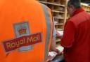 Royal Mail workers at a sorting office
