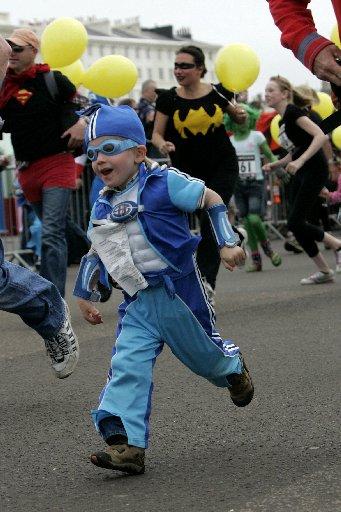 THEY might not have been able to
fly faster than a speeding bullet but
about 1,500 superheroes were more
than capable of handling a 10km
run along the seafront.
Capes were fluttering, plenty of
Lycra was on show and there was face
paint aplenty as 