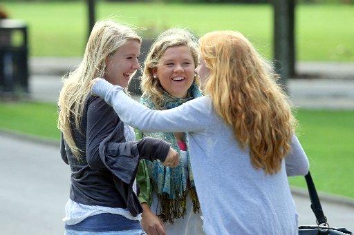 16-year-old Harriet vans Agew, left, celebrates GCSE results with classmates at Brighton College.